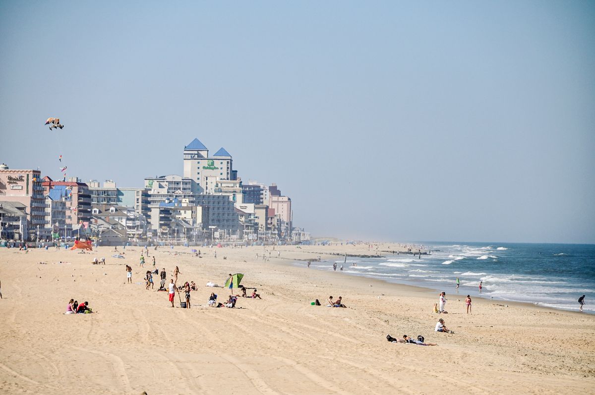 Sunny beach in front of oceanfront towers