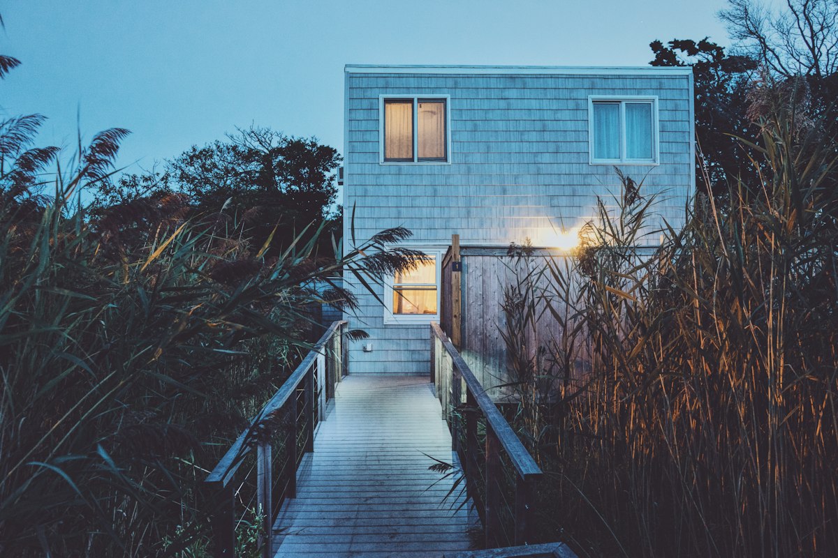 House with a lit walkway at dusk