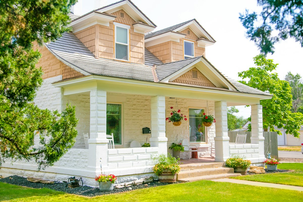 White farmhouse with a wide front porch